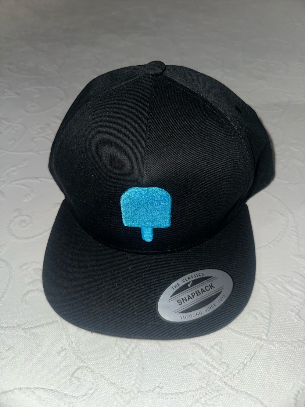 Black Snapback Cap with Blue Popsicle Logo